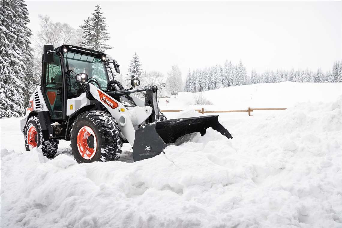 bobcat L85 compact wheeled loader with snow bucket attachment