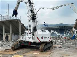 The CAT 6015 Jumbo Demolition on site at Atalanta FC's stadium