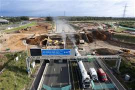 Demolition excavators taking down the two-span M42 bridge