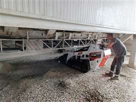 A man using the Bobcat MT55 mini track loader at Santos Jorge's recycling plant