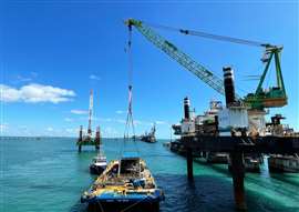 A crane lifting components from the Hay Point Terminal