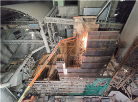 A worker in an aerial platform performing dismantling tasks