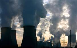 Steam rises from four cooling towers at Fiddlers Ferry Power Station