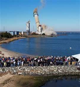 BL England Generating Plant's smokestack is brought down via explosives