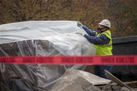 A demolition worker wearing PPE