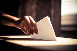 Conceptual image of a person voting during elections