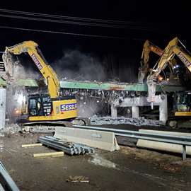 Sessler Wrecking's excavators demolish the Brookside Road Overpass Bridge in New Platz, New York