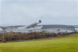 The felled chimney moments before it hit the ground