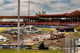 Inside Chain of Lakes stadium in Florida, demolished material piled up