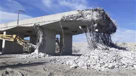The concrete slab being demolished