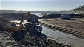 Wide view of the cofferdam with an opening and machines working on top of it