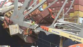 CDI operatives working at height to cut the metal truss for the placement of explosives