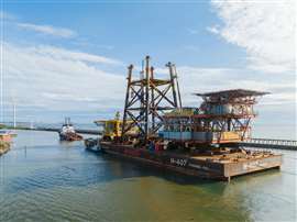 Audrey and Ensign platforms being transported on a barge