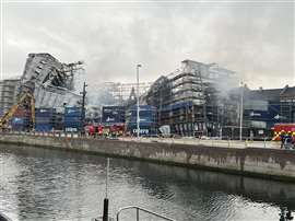 The Old Stock Exchange Børsen building still smoldering