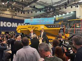 Melker Jernberg speaks in front of a Volvo A30 articulated dump truck at Bauma 2025