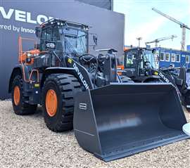 A Develon D7 wheeled loader fitted out with the new waste and recycling protection kit