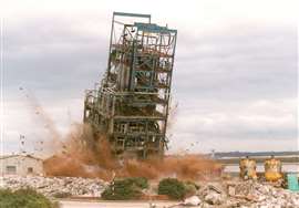 The explosive demolition of the paraquat distillation column at Widnes, United Kingdom. (PHOTO: J Wolstenholme)