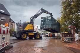 A Volvo EWR170 wheeled excavator shown lifting a container. (Photo: Swecon)