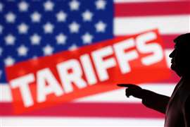 Illustration shows 3D-printed miniature model depicting U.S. President Donald Trump, U.S. flag and word "Tariffs"