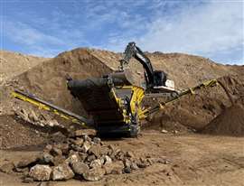 Yellow scalper working in gravel pit