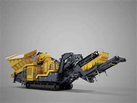 Yellow tracked impact crusher on grey background