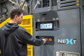 Man operating the digital display which controls the crushers