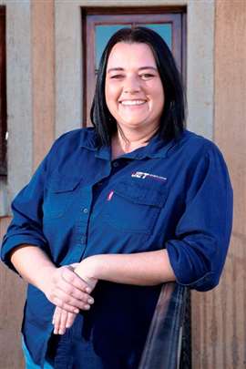 Picture of woman smiling wearing a blue shirt