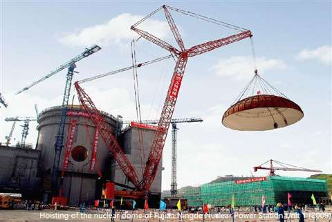 red crane lifting a big dome