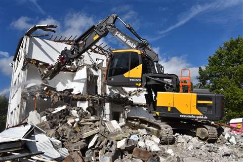 Scholko's new Volvo EC220E with lift cab demolishing a building