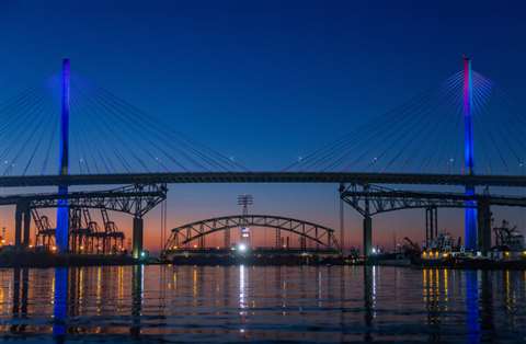 The Gerald Desmond Bridge's main span is lowered for removal as the first step in the bridge's demolition.