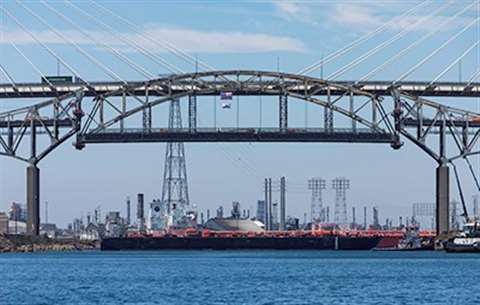 The Gerald Desmond Bridge's center span is lowered for removal as the first step in the bridge's demolition