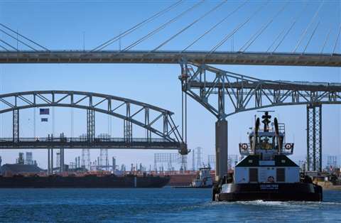 The Gerald Desmond Bridge's main span is lowered for removal as the first step in the bridge's demolition.