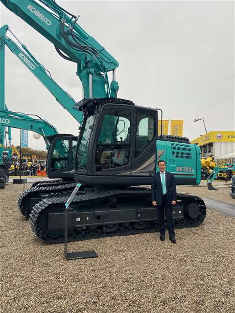 Makoto Kato, managing director of Kobelco’s European operations, with a Kobelco SK180-LC excavator