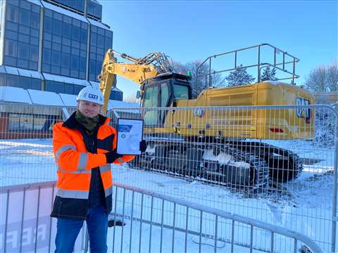 Ben Griffiths of Rye Group standing in front of construction machinery