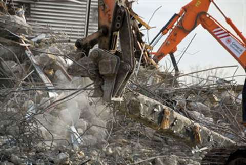 Buildings at the North Middlesex University Hospital are being brought down while treatment for pati