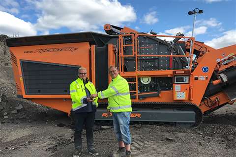 Niklas Johansson, Rockster sales partners, hands over Rockster R1000S mobile crusher to Andreas Pettersson, Swerock Recycling