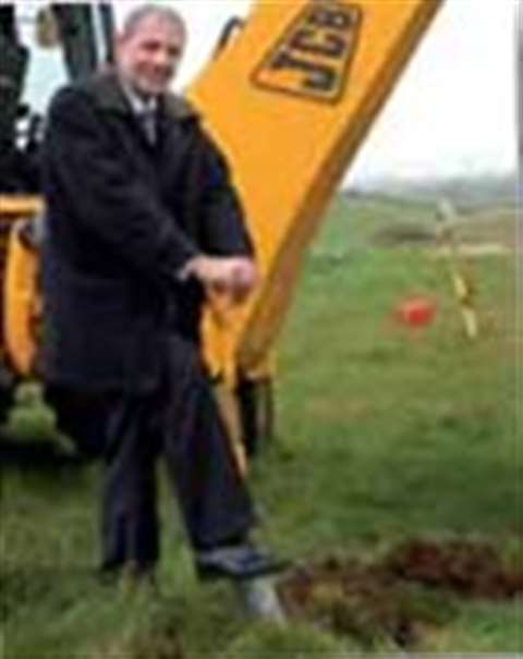 John Patterson, JCB aging director and CEO, aks ground for the new achments plant.