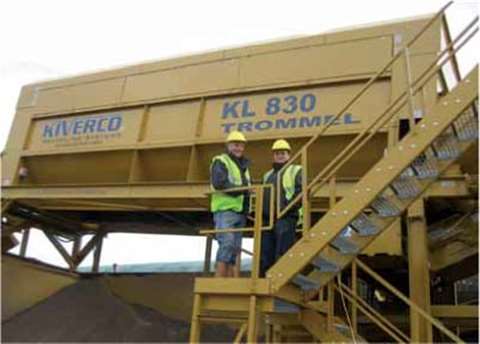Ron Weir (left) and Danny Weir beside their new acquisition–a Kiverco recyclingplant