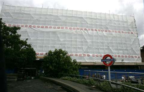 Tower House was covered in a tough plastic sheeting to prevent dust and debris escaping as well as f